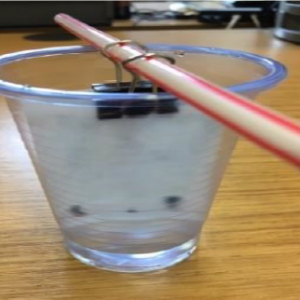 plastic cup with paper and straw